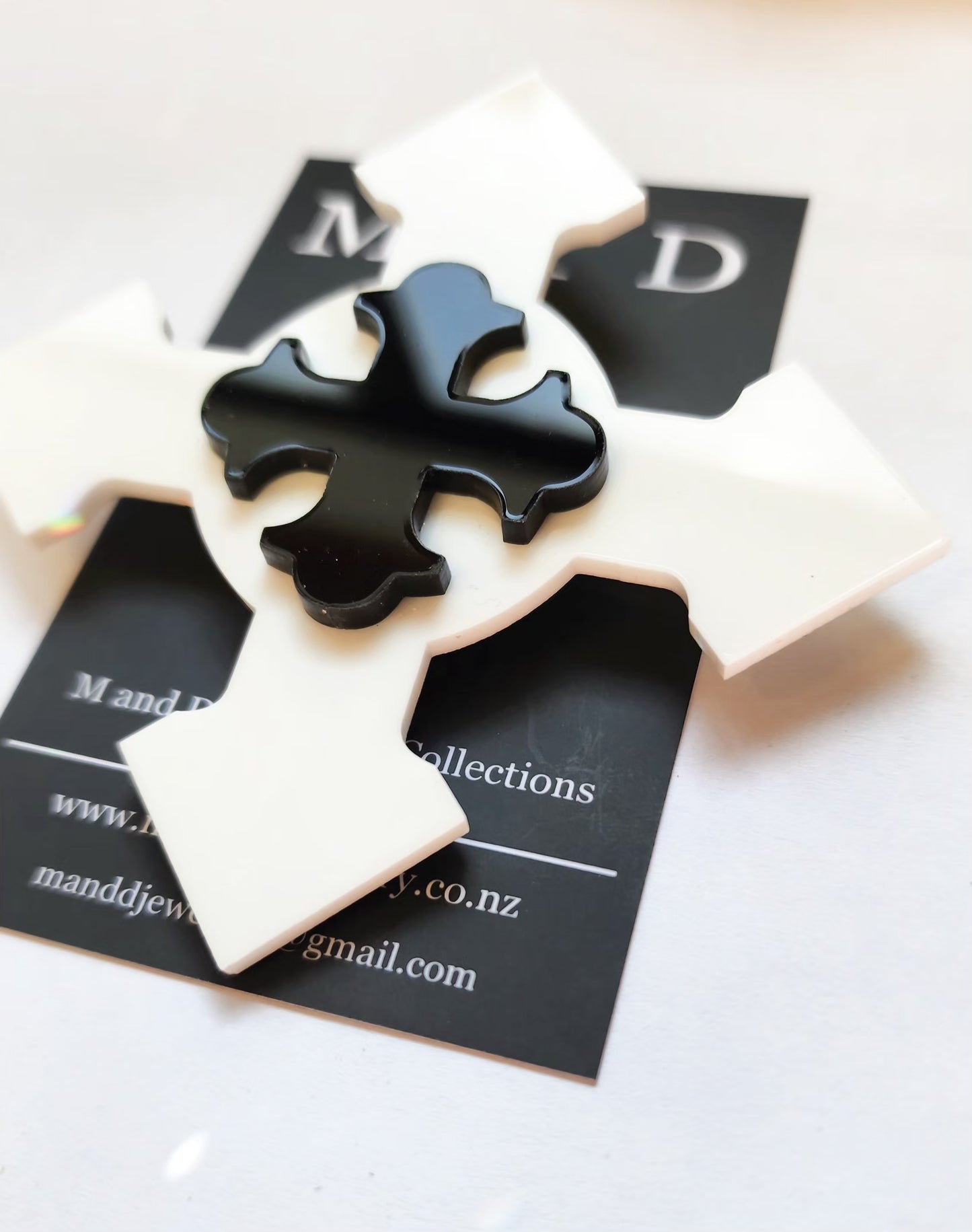 Brooch Large White Botonee Cross with Black layer.