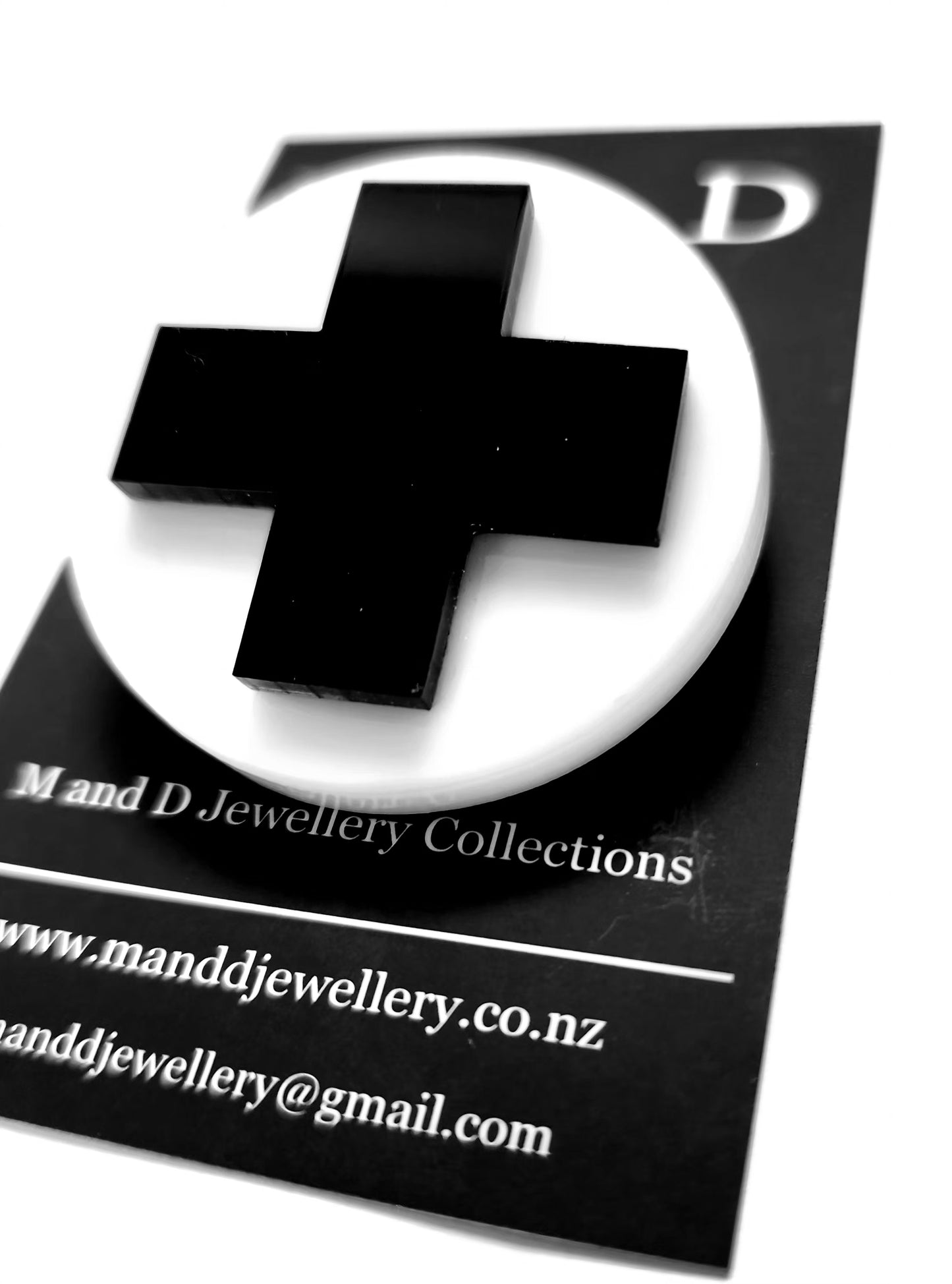 Brooch White Disc with Black Plus layer.