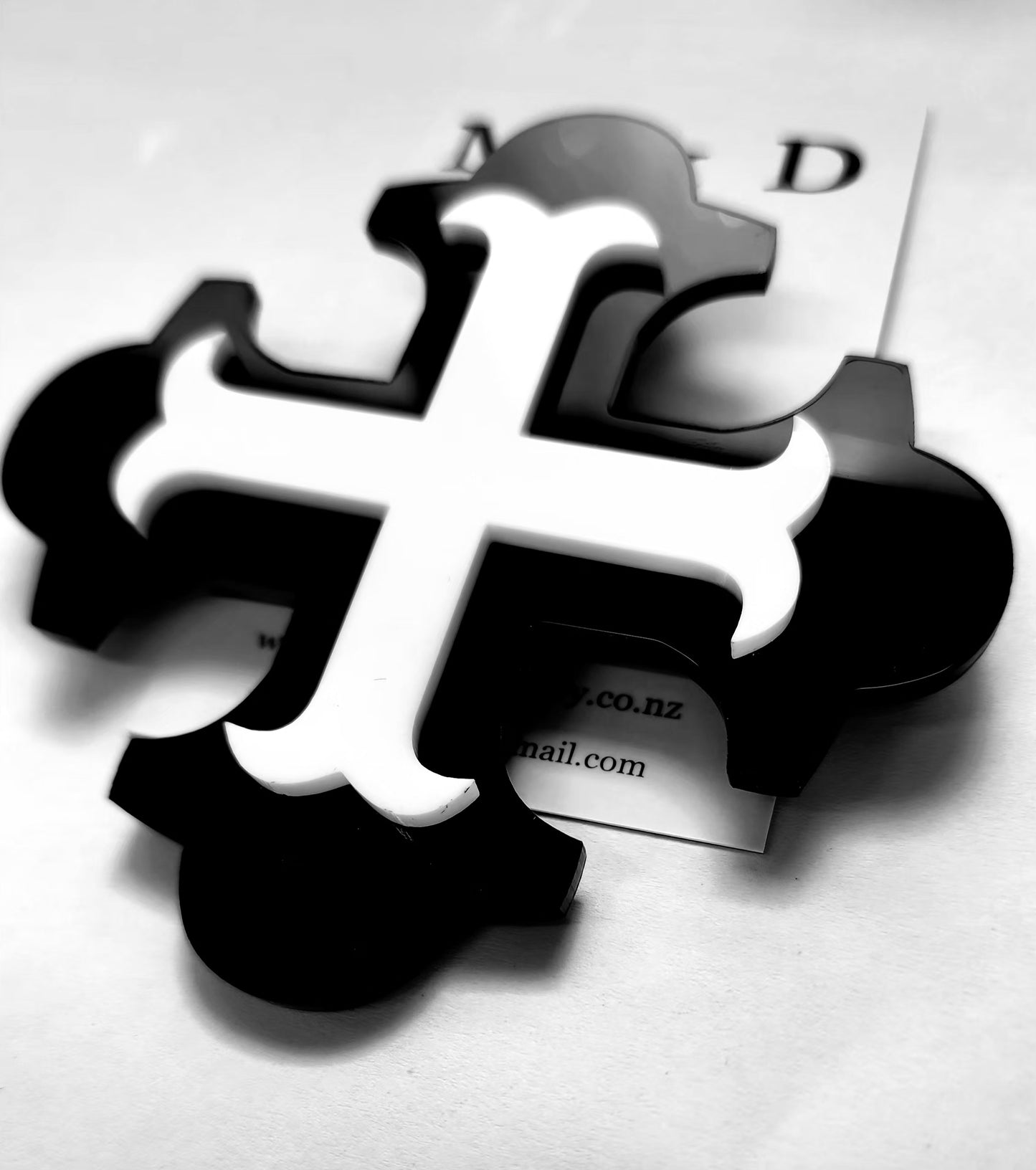 Brooch Large Black Botonee Cross with White bar layer.