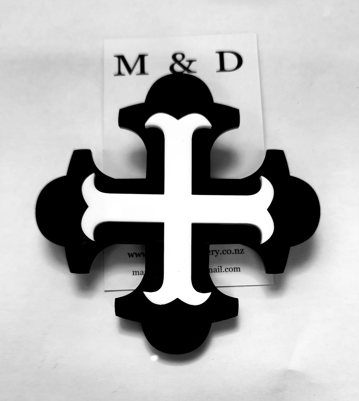 Brooch Large Black Botonee Cross with White bar layer.