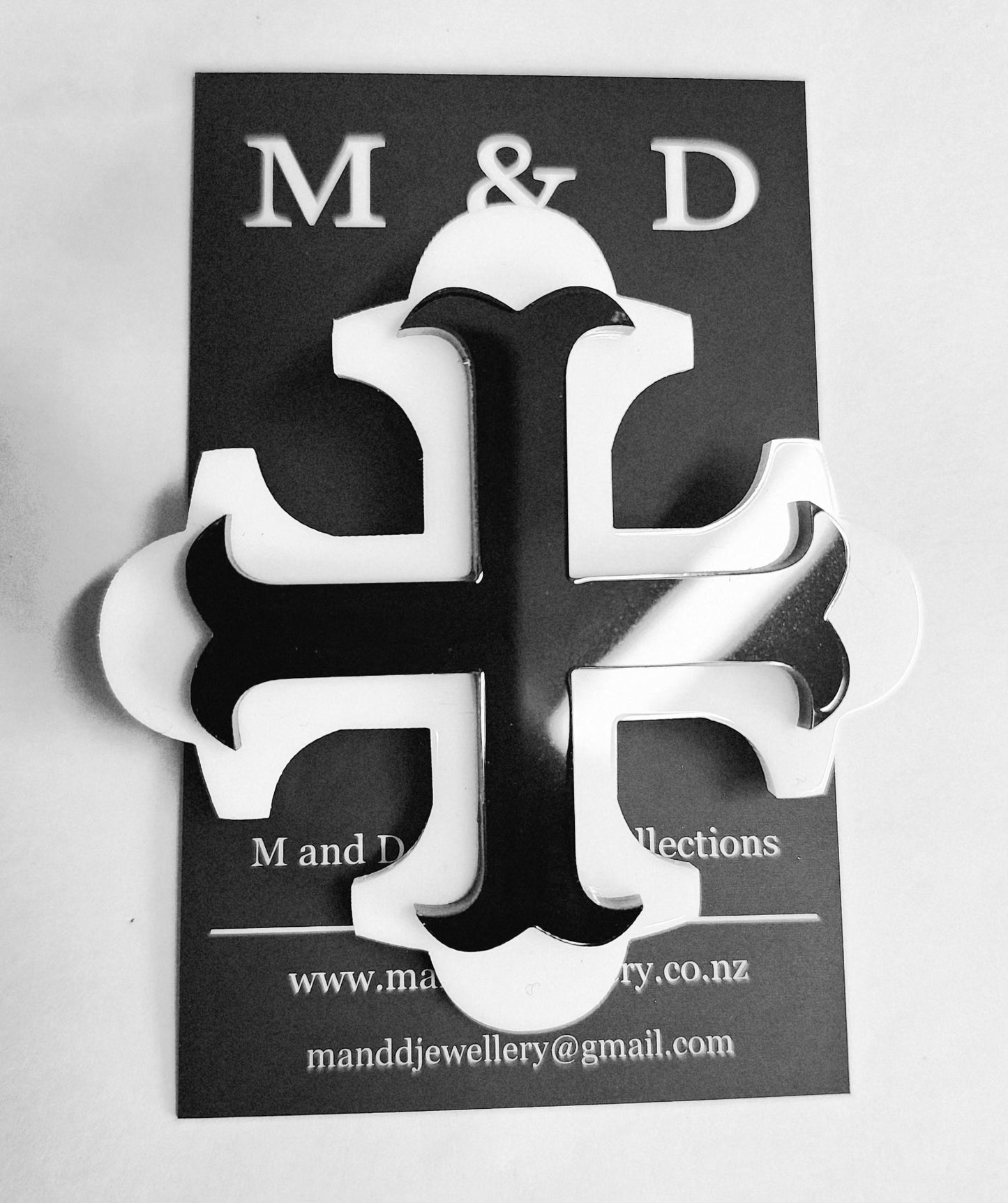 Brooch Large Black Botonee Cross with White bar layer.