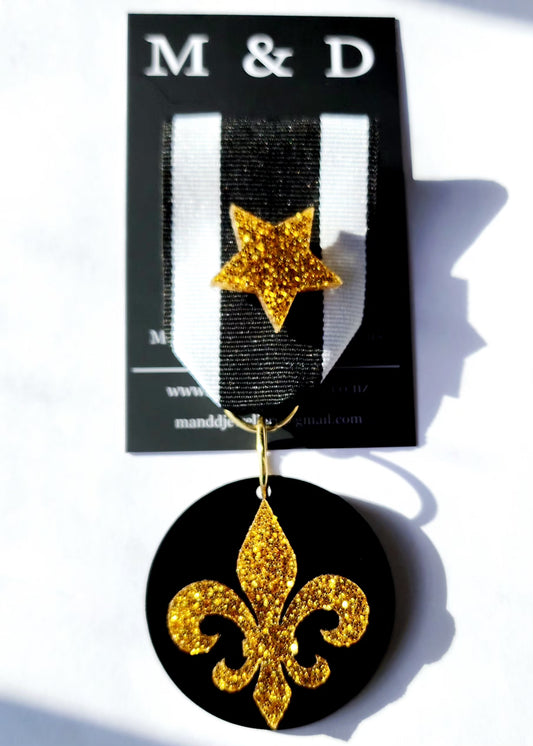 Ribbon Brooch Gold Glitter Fleur Layered on Black Disc with detachable Star Pin