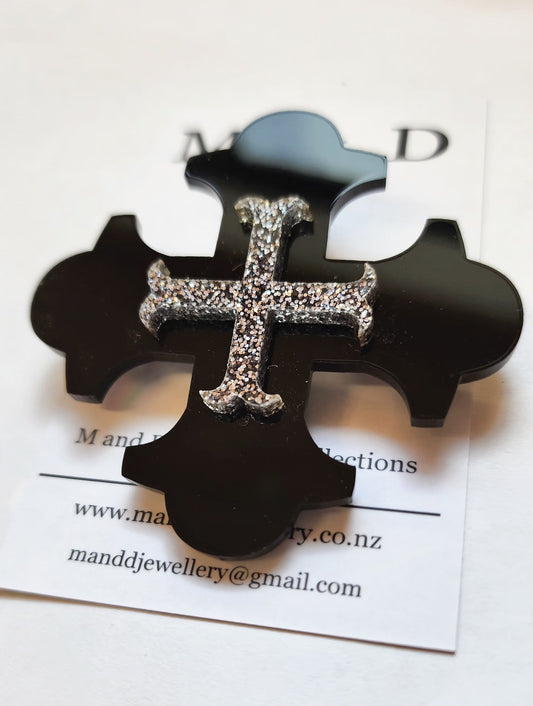 Brooch Black Botonee Cross with Silver Glitter bar layer.