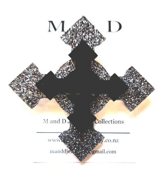 Brooch 4 point Black Glitter cross with layer.
