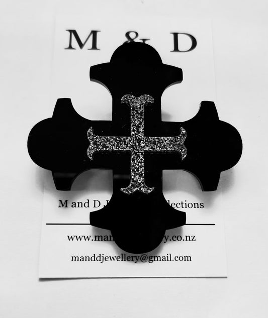 Brooch Black Botonee Cross with Silver Glitter bar layer.