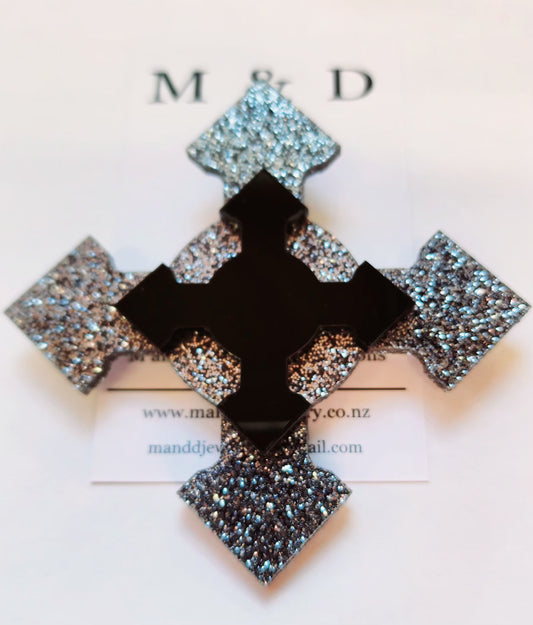 Brooch 4 point Black Glitter cross with layer.