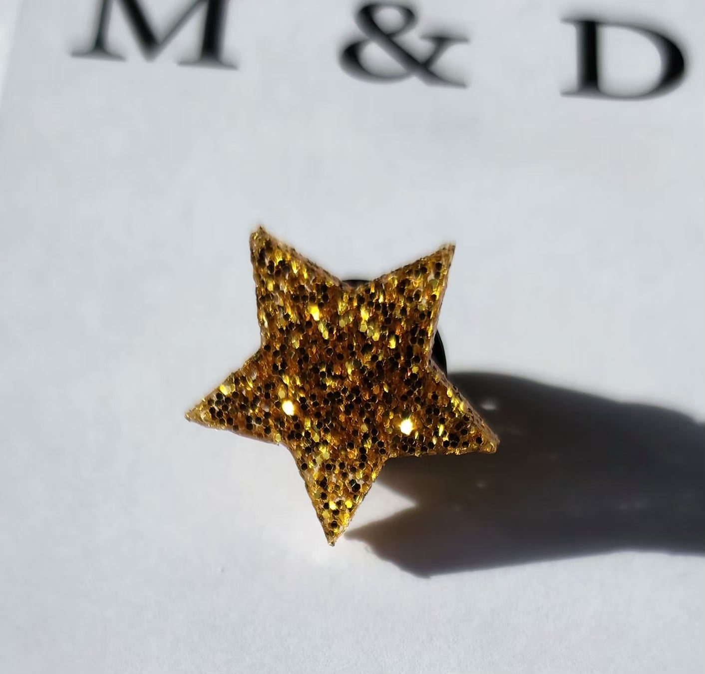Ribbon Brooch Gold Glitter Fleur Layered on Black Disc with detachable Star Pin