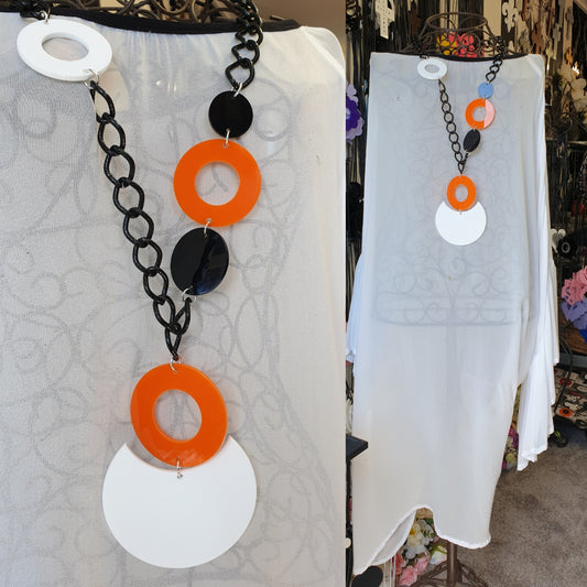 Lariat Orange black white circles with white pendant